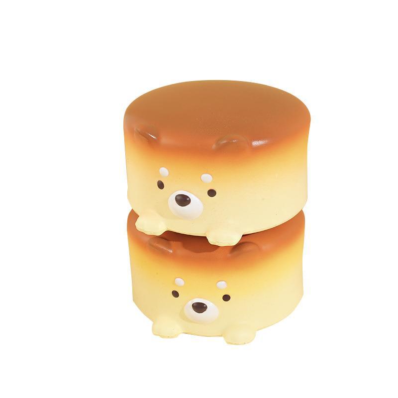 Slow Rise Cheese Cake Dog squishy toy being squeezed, showing slow-rebound texture