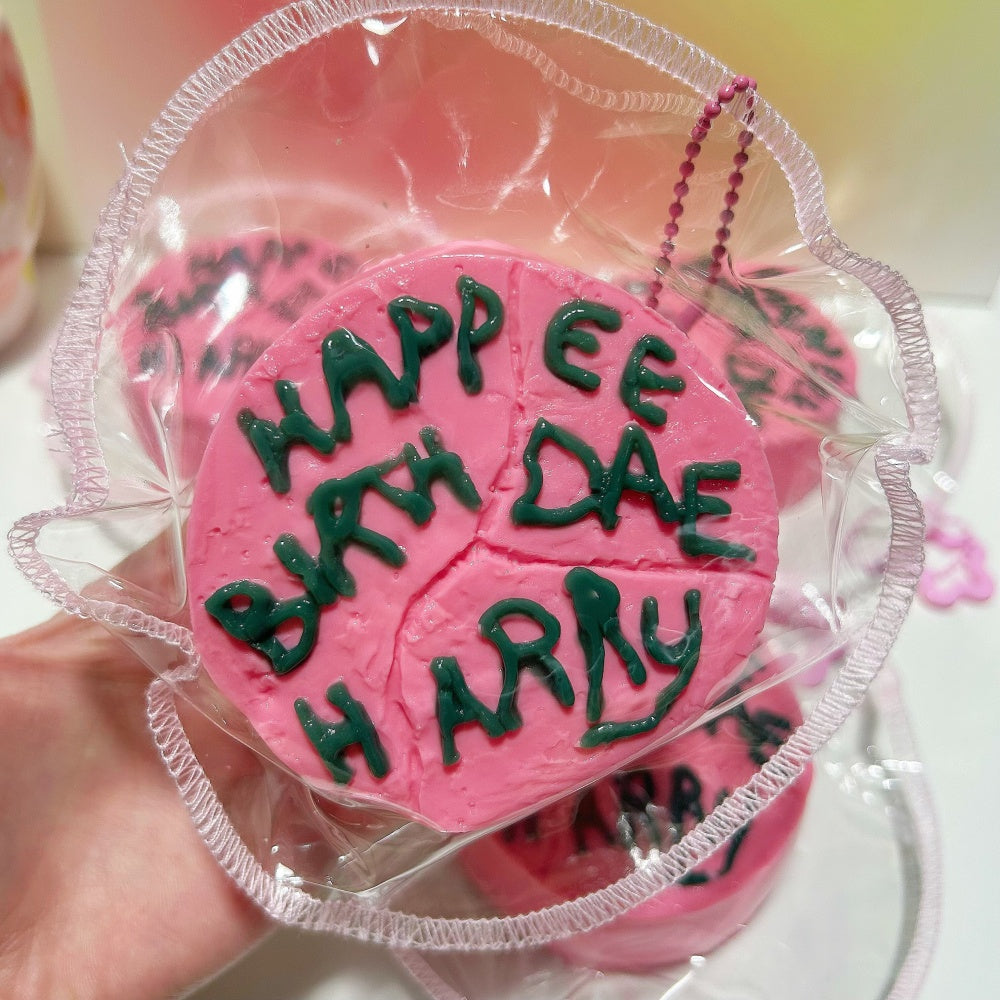 Happee Birthdae Cake squishy toy, front view showing 3D frosting texture