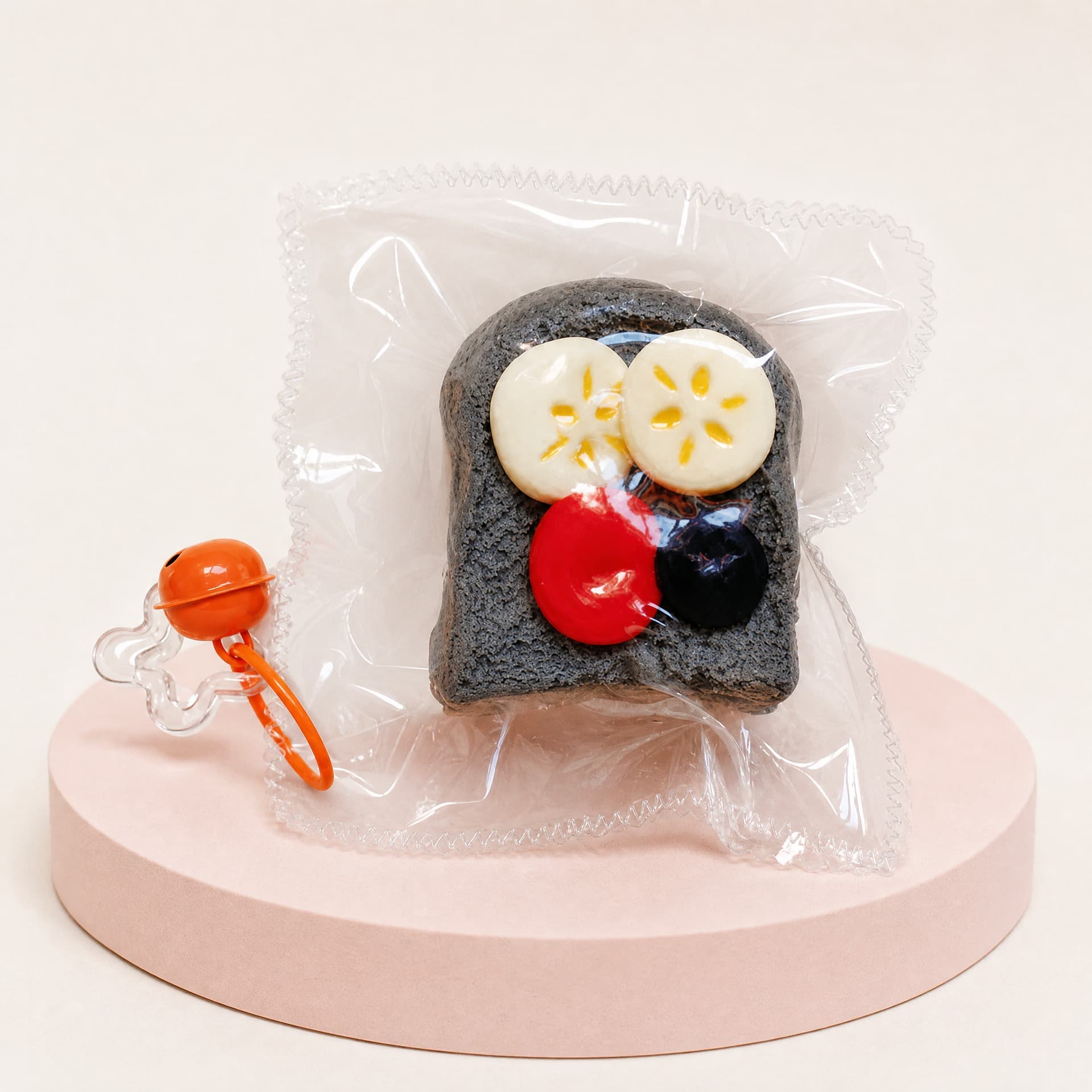 Squidgy Bread Collection toy, dark fruit toast design