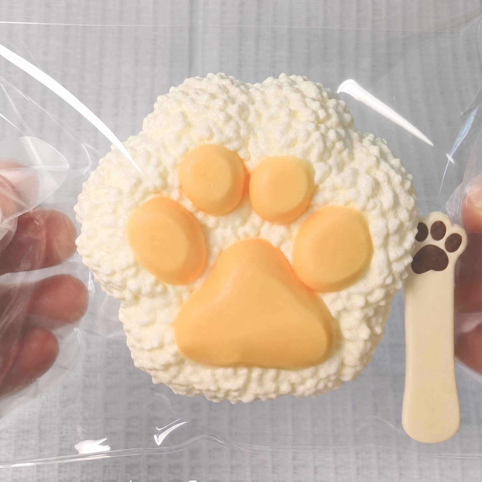 Squishy Rice Cat Paw Taba toy, cream color, front view