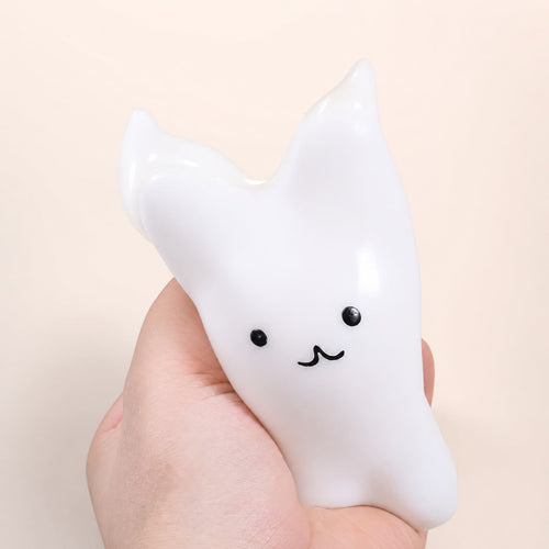 Cat & Bunny Custard Pinch toy, bunny design, held in hand
