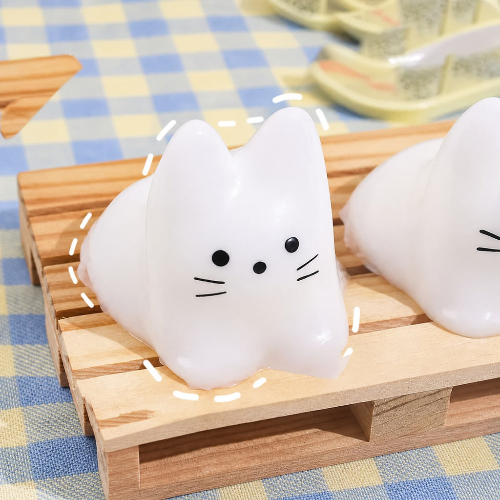 Cat & Bunny Custard Pinch toy, white cat design in scene