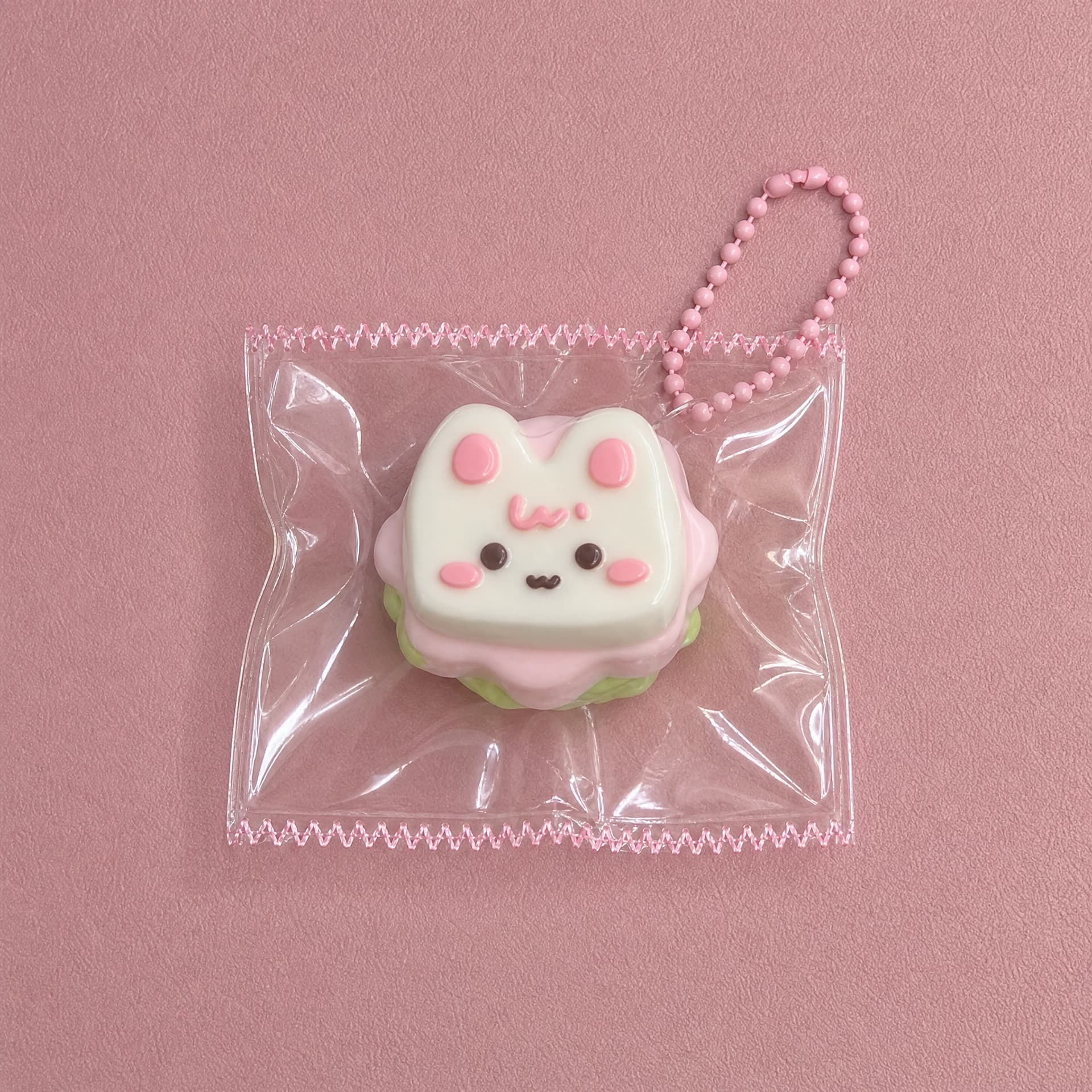 Lil Mini Squeeze Charm, kitty cake design on pink background