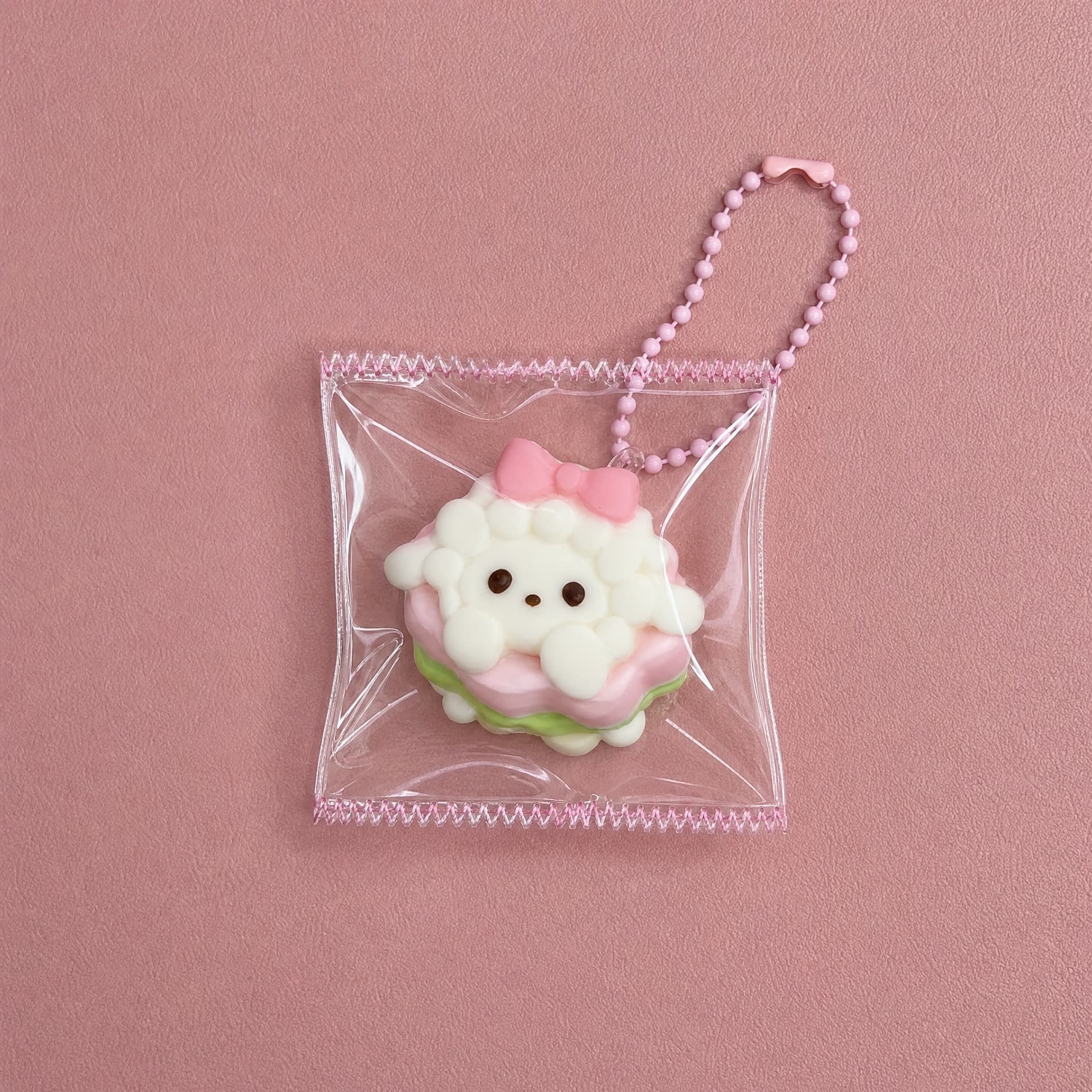 Lil Mini Squeeze Charm, lamb cake design on pink background