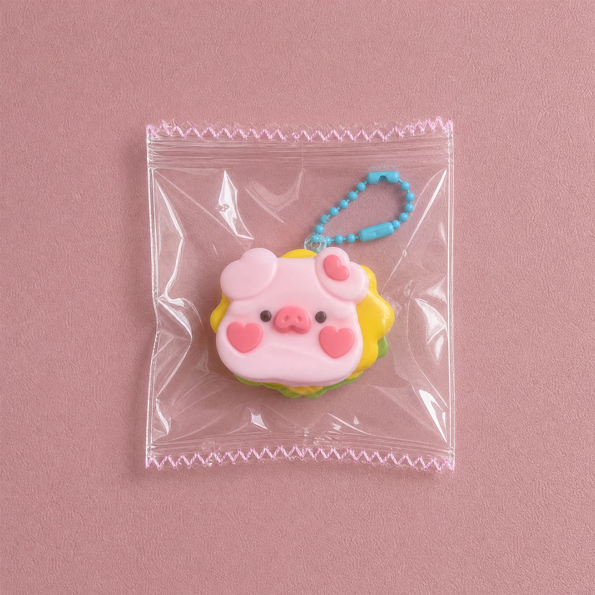 Lil Mini Squeeze Charm, pig burger design on pink background