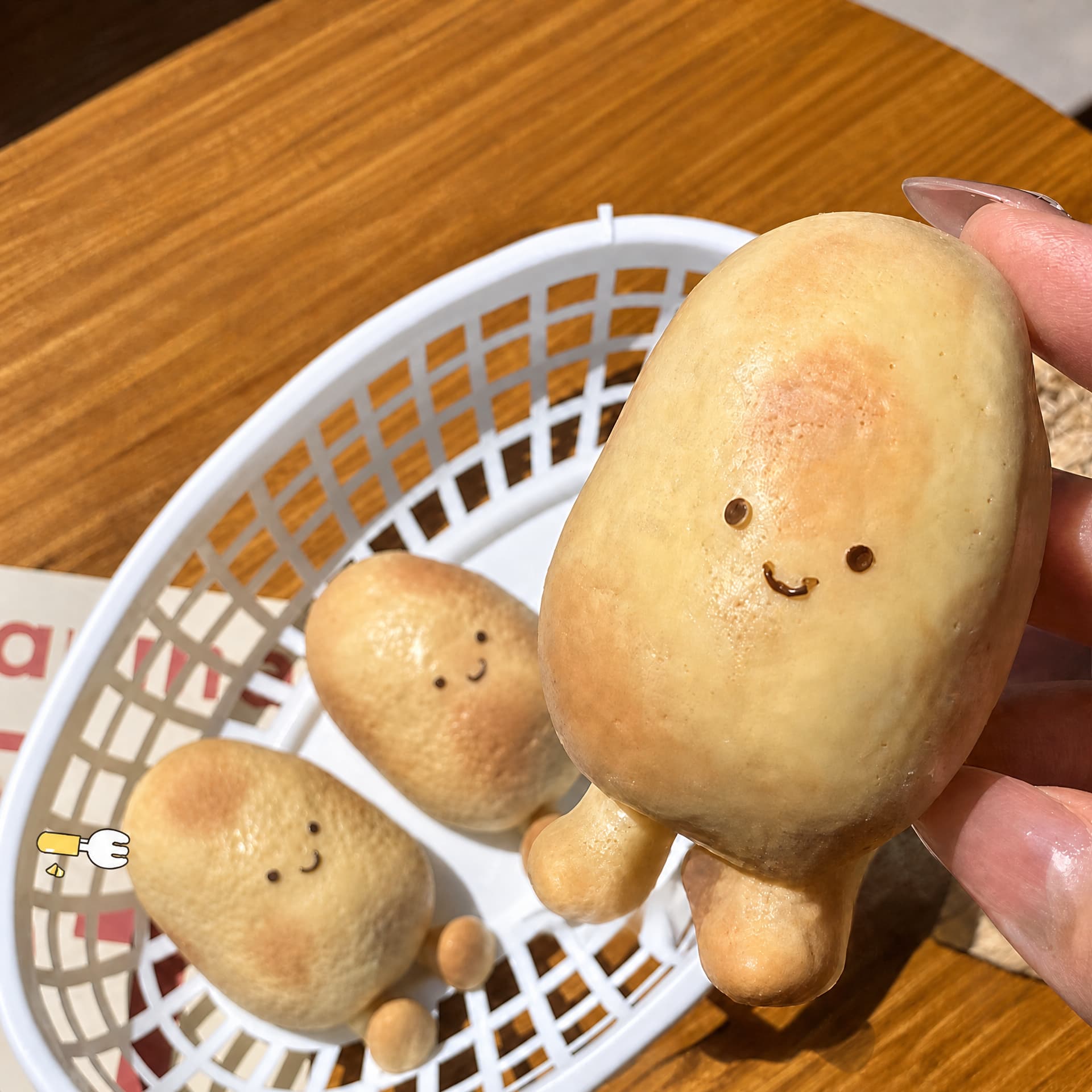 Pinch Potato squishy toy held in hand for scale